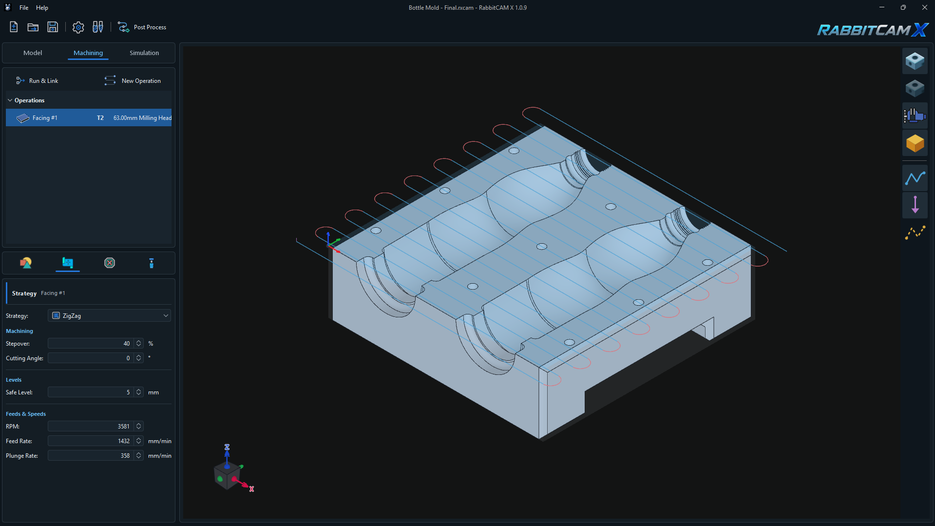 RabbitCAM X Facing operation with ZigZag toolpaths over a mold stock and the Strategy panel showing Stepover, Cutting Angle, Safe Level, RPM, Feed Rate, and Plunge Rate.
